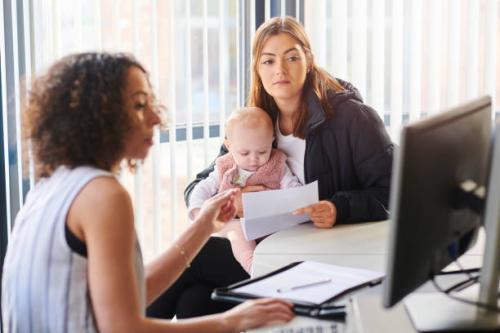 young mother with social services or housing officer